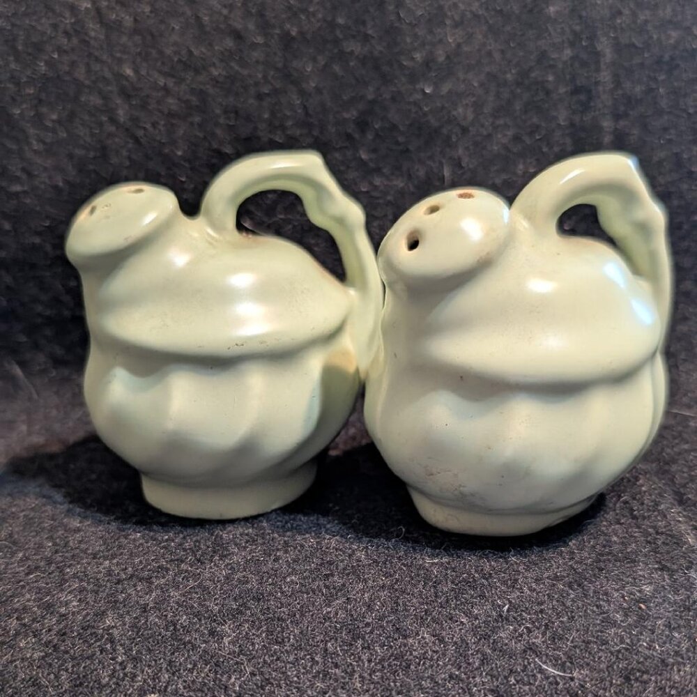Ceramic pitcher-shaped salt and pepper shakers in celadon green glaze